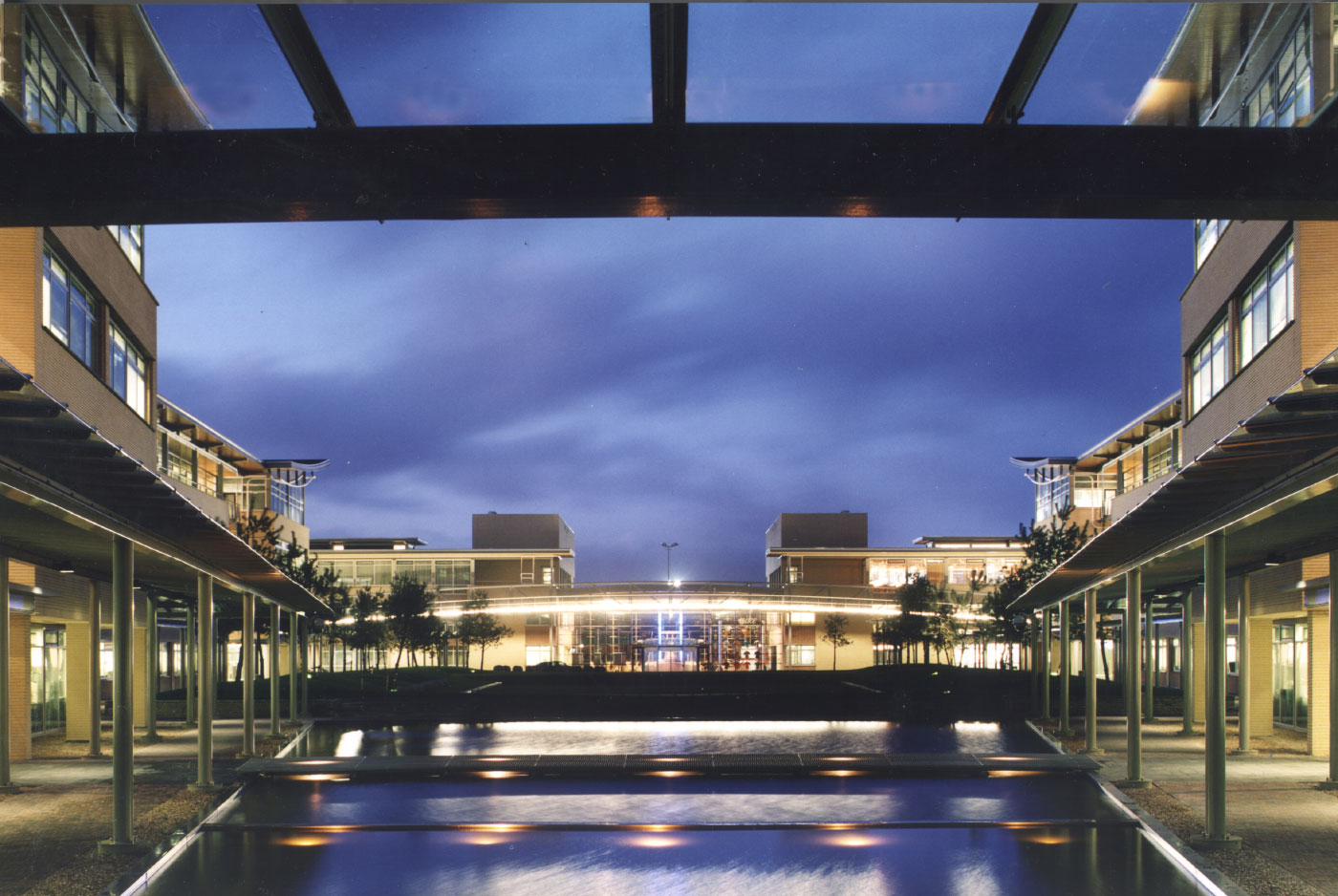 Night View of the Nike European Headquarters in Hilversum, The Netherlands with Green Roof over Underground Garage has the Largest Geothermal Installation in Europe by Green Charlottesville Architects
