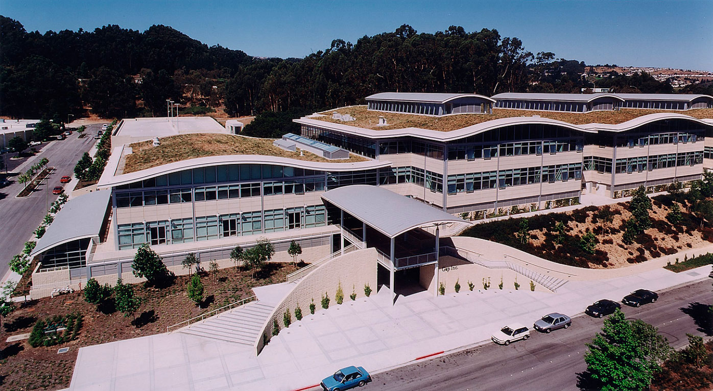 Undulating Green Roofs, Roof Monitors, Stepped Volumes and Entrance with Standing Seam Metal Roof Supported by Painted Steel Structure at the Gap Corporate Campus now Banana Republic Designed by Well-Known Virginia Architect.