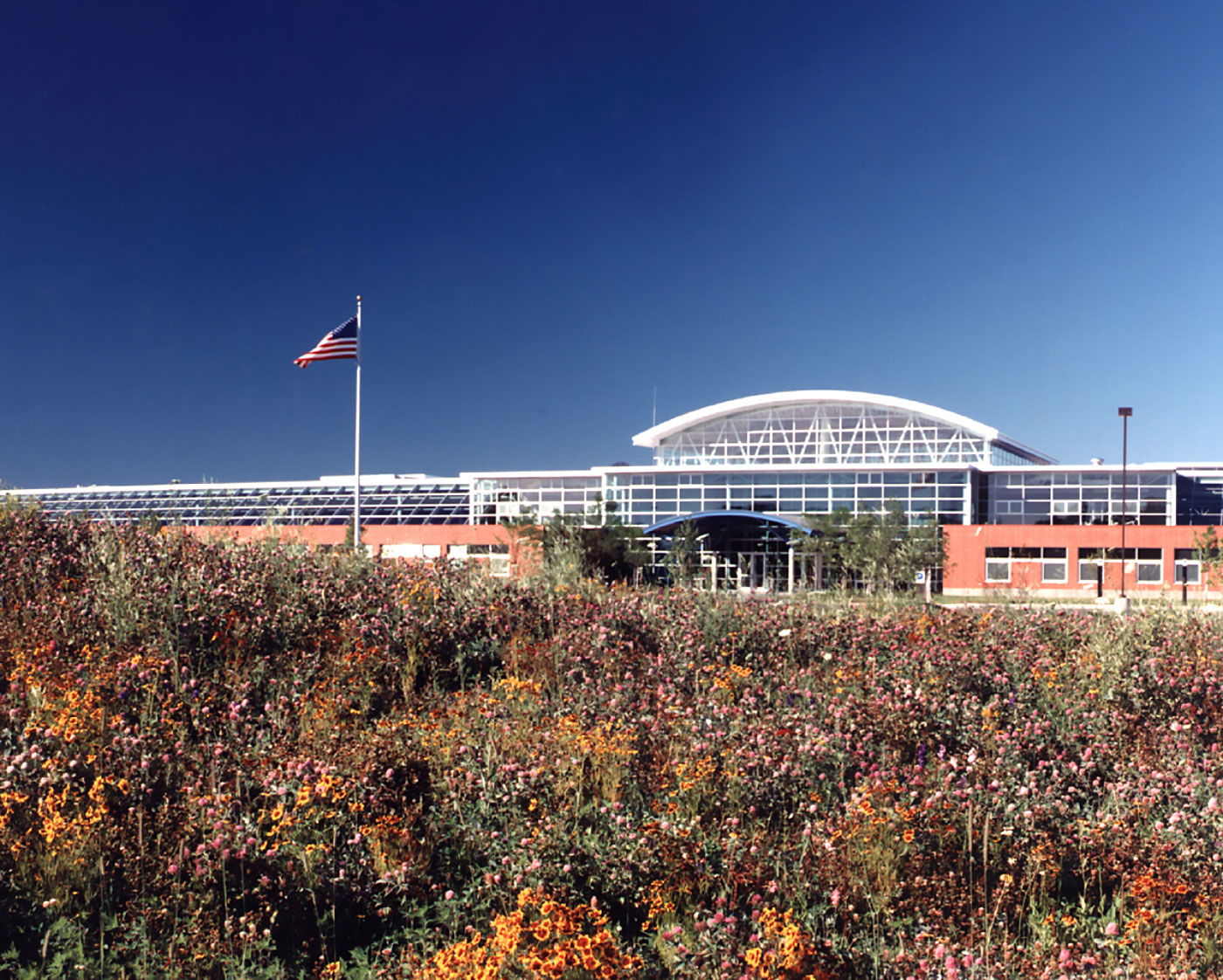 Modern and Green Herman Miller Factory in Traverse City, MI is Two-Story with Tall Roof Monitor Bringing Daylight to the Factory Floor by Virginia Commercial Architect.