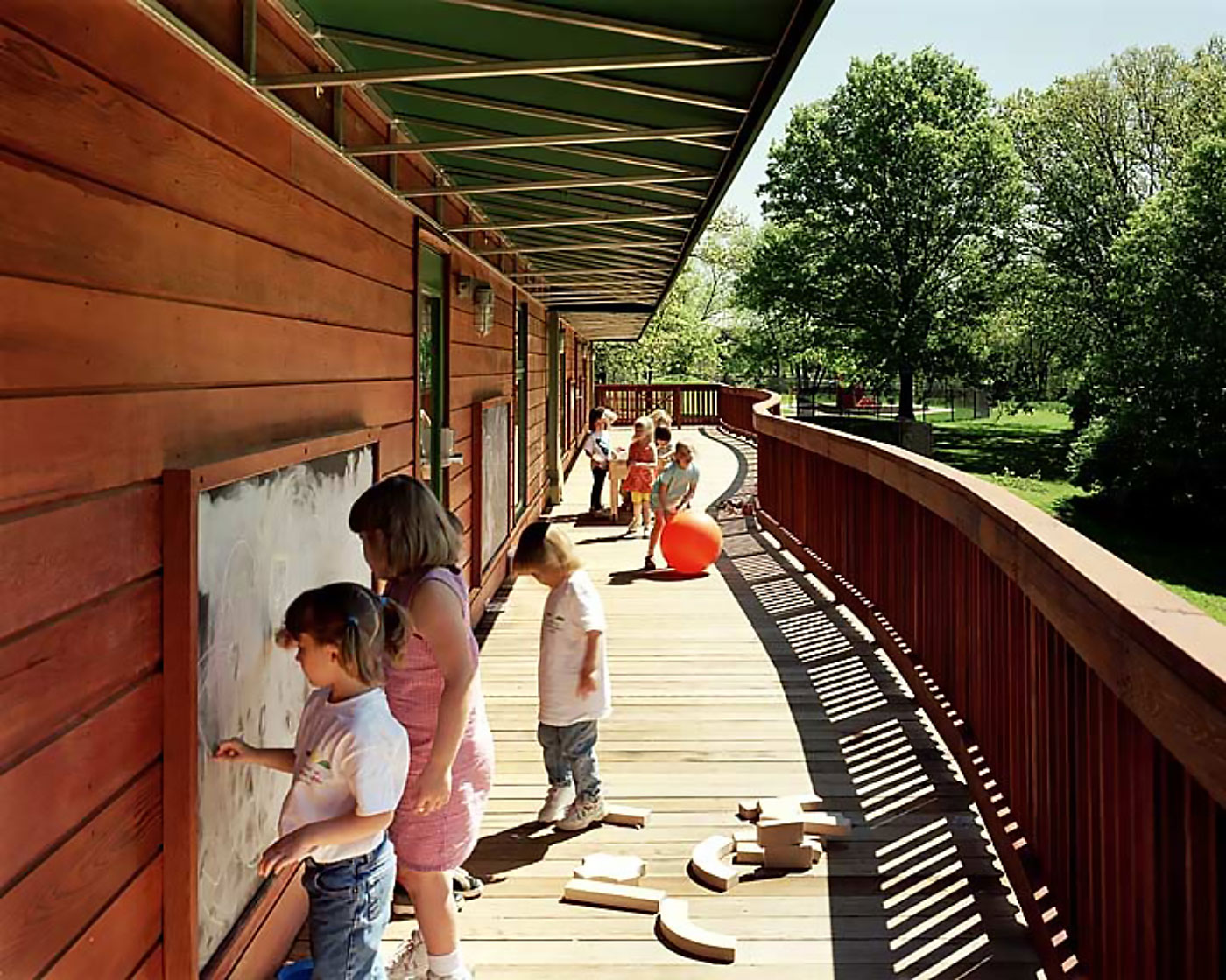 Children's Day Care Center in St Louis by Virginia Architect has Deep Overhangs, Chalkboards and Curved Play Deck.